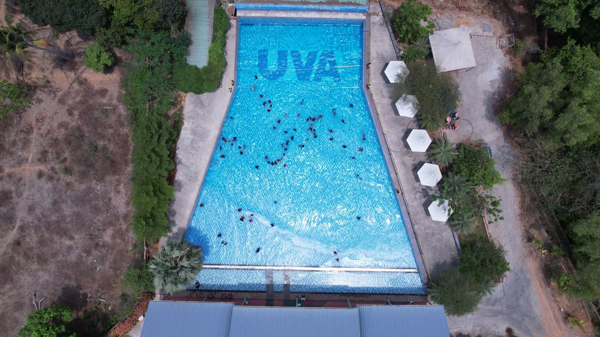 Aerial view of the large UVA Meridian swimming pool with guests swimming