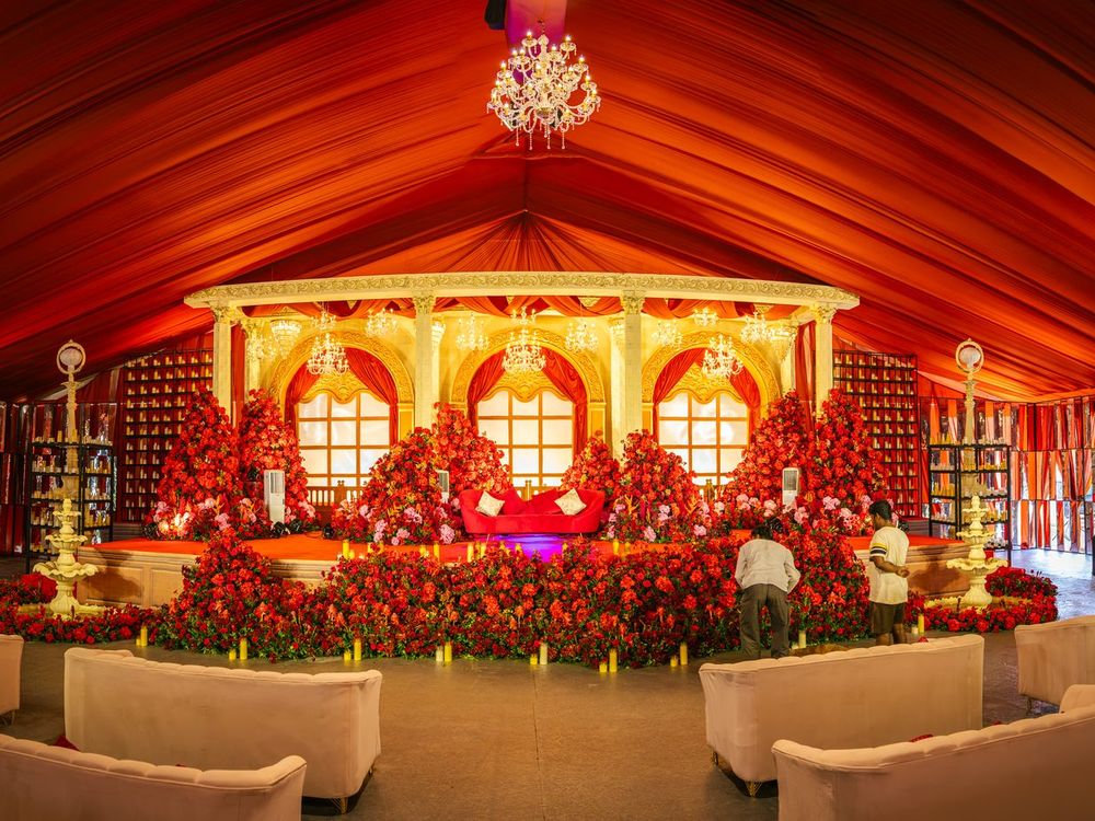 Floral wedding mandap under a draped canopy at UVA Meridian