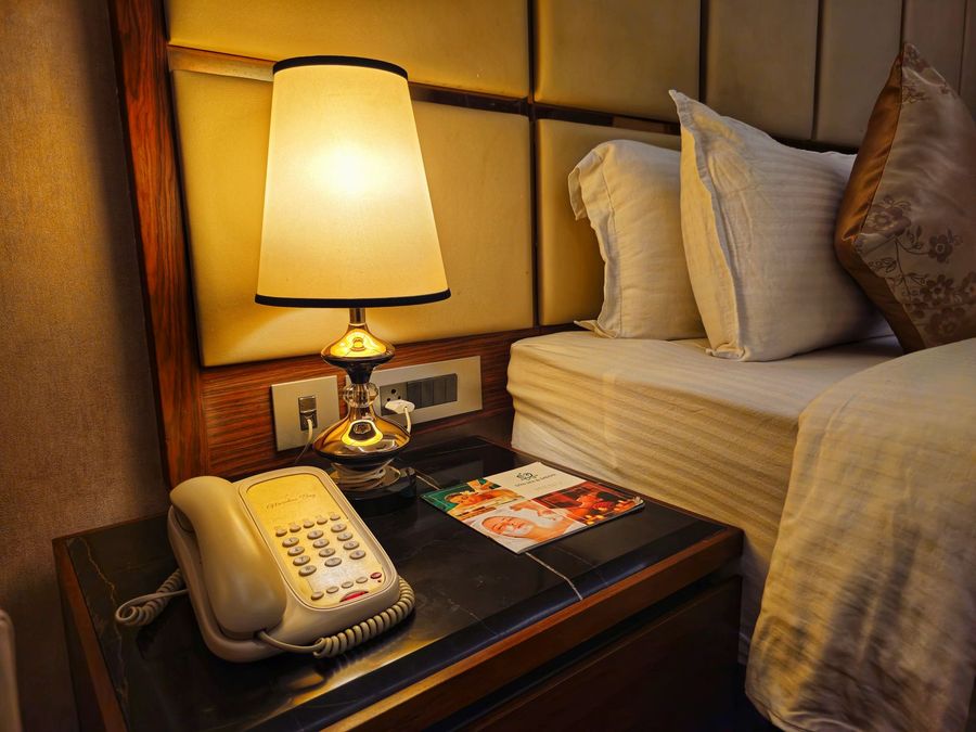Bedside lamp and phone for in-room dining
