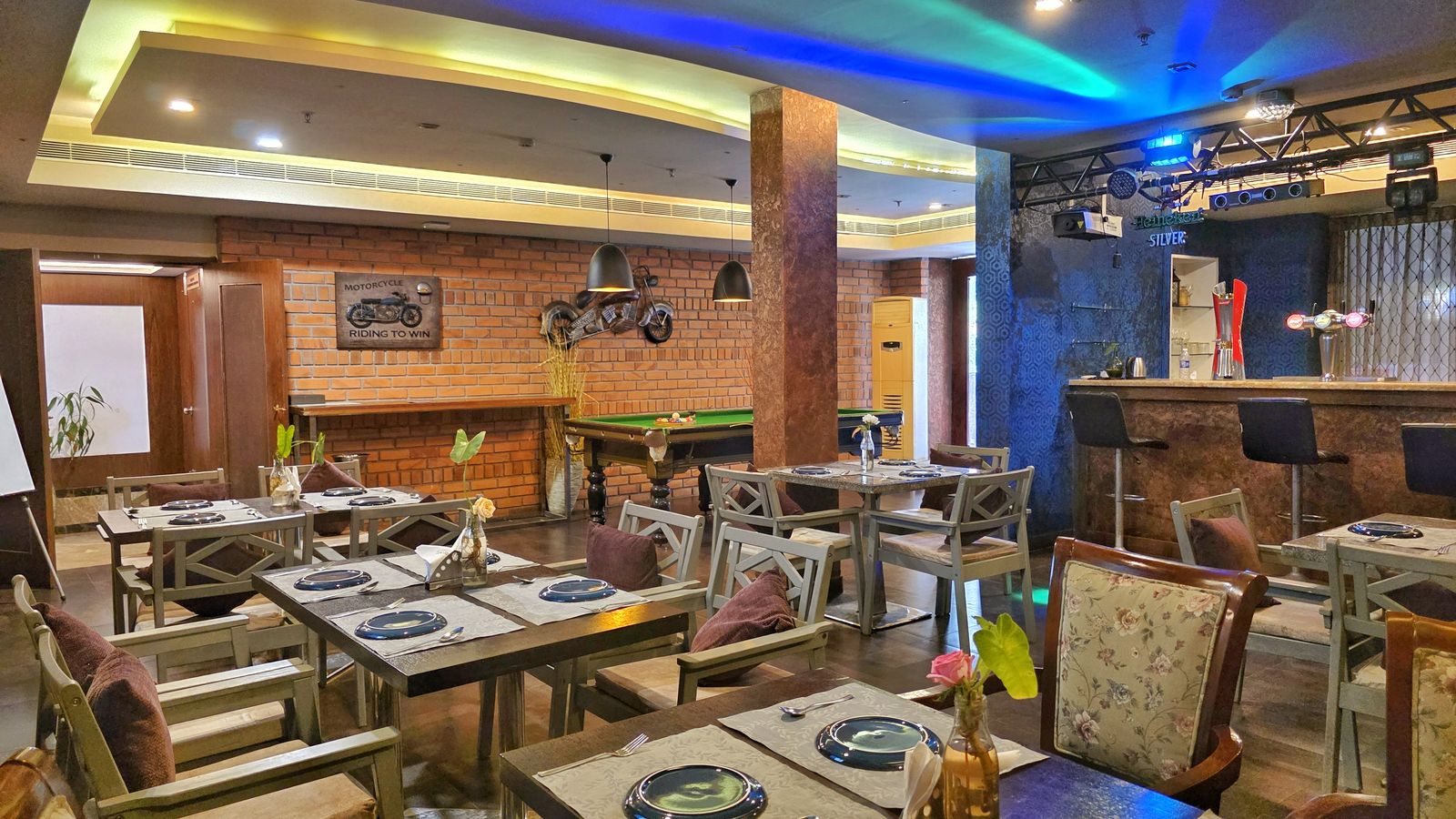 Table setting and lounge seating at Club Meridian, UVA Meridian